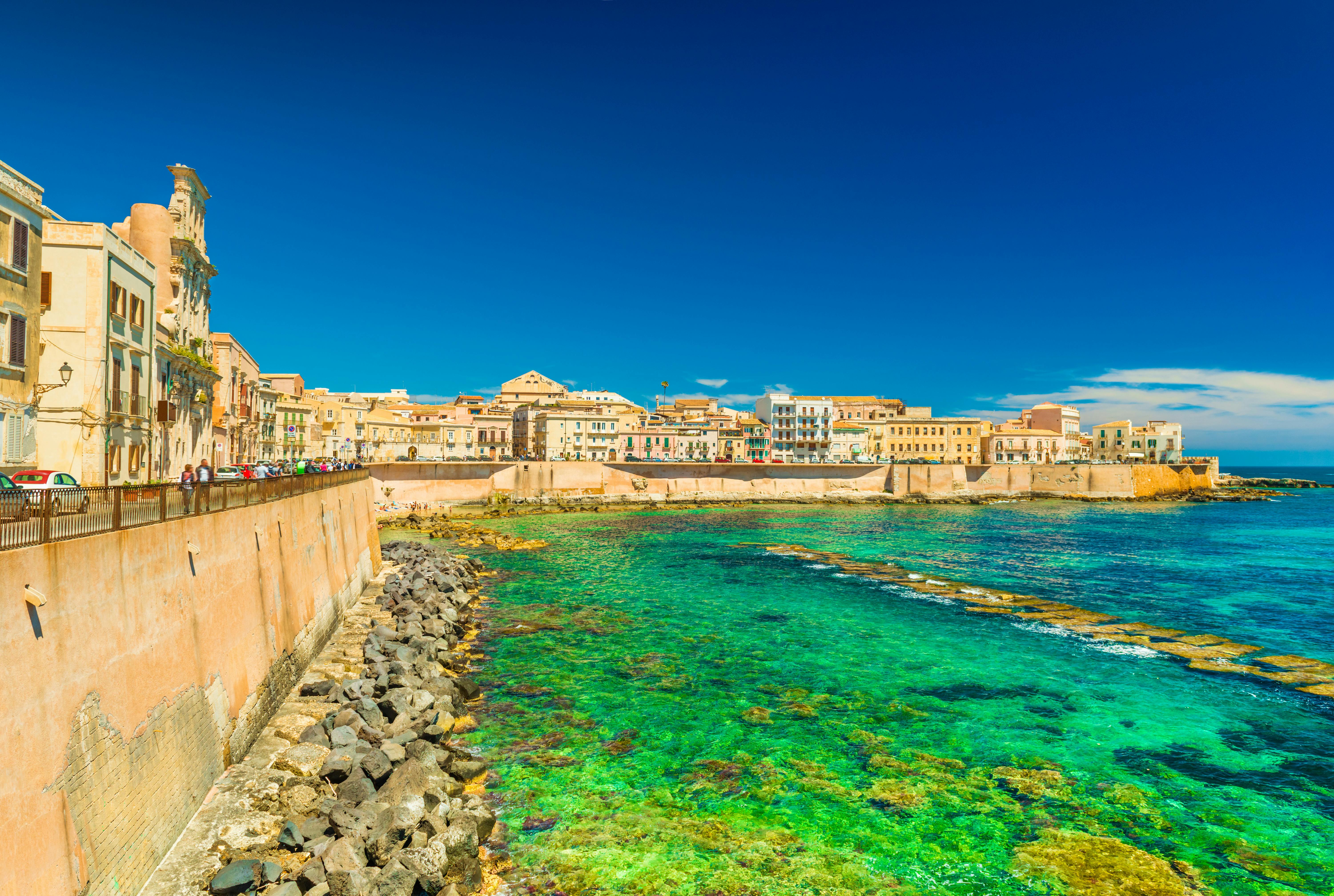 Scenic view of a promenade in Syracuse (Ortigya), Sicily, Italy. Picturesque coastline in the famous Sicilian town