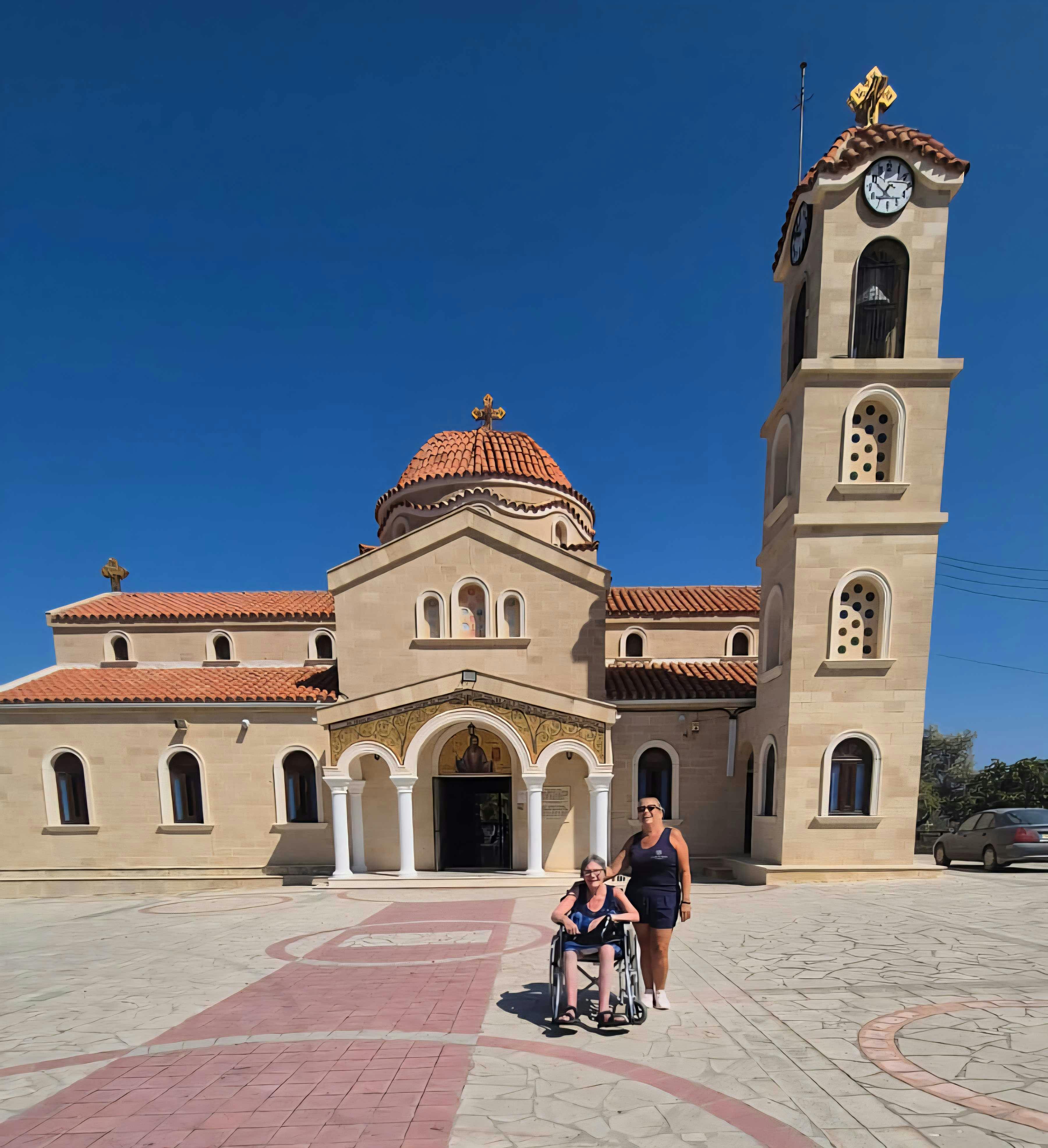 Customer and staff in Cyprus in front of Kykkos Monastery
