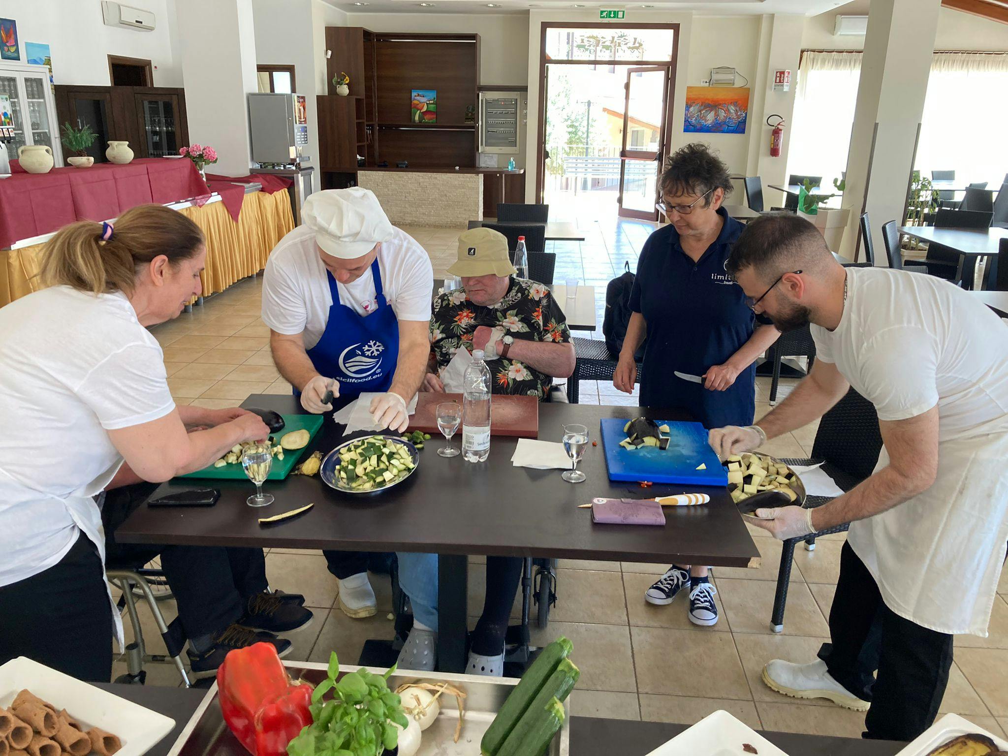 Customers enjoying a cooking class in Sicily