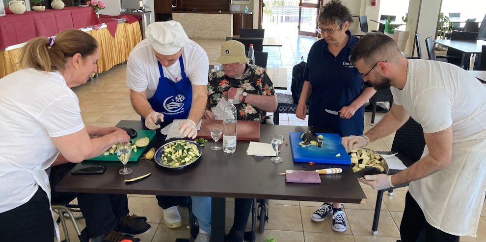 Customers enjoying a cooking class in Sicily
