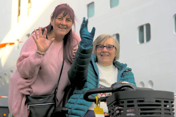 Customers waving by P&O cruise ship before boarding