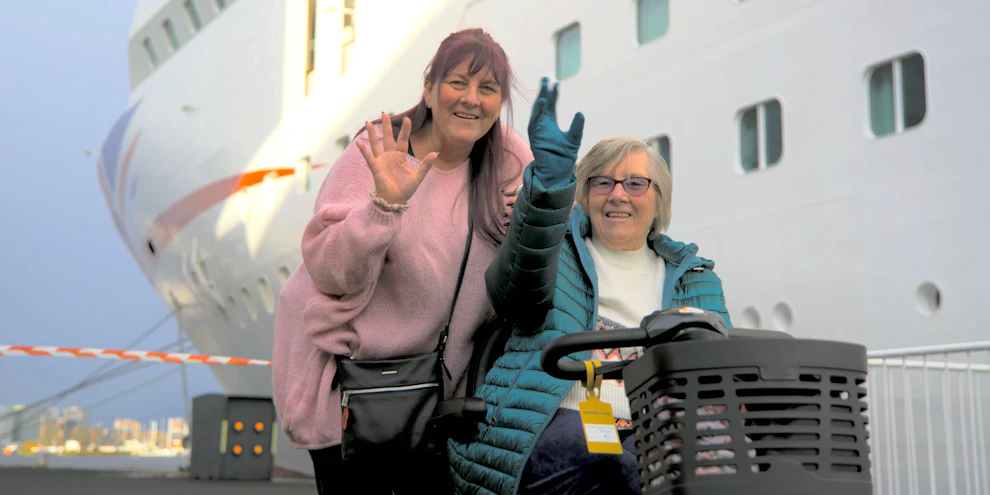 Customers waving by P&O cruise ship before boarding