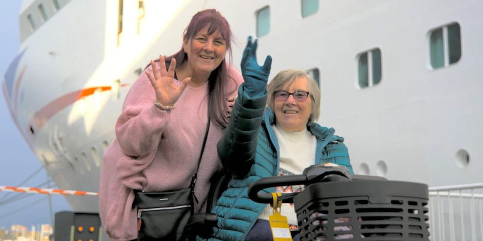 Customers waving by P&O cruise ship before boarding