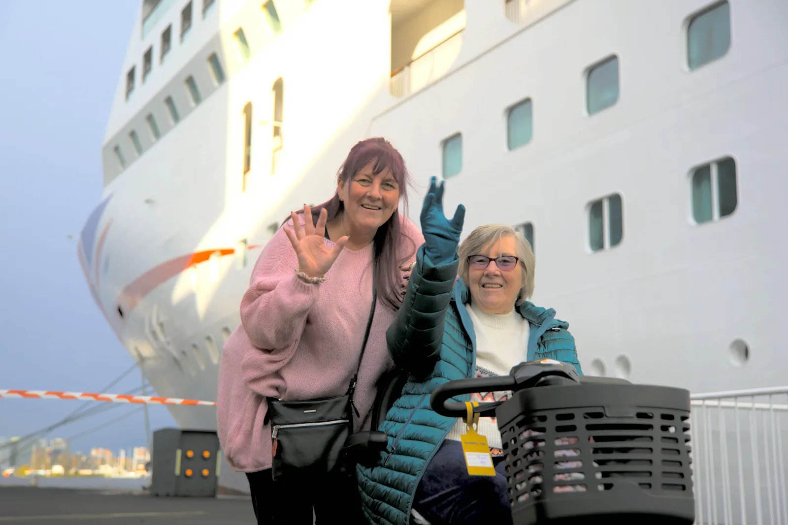 Customers waving by P&O cruise ship before boarding