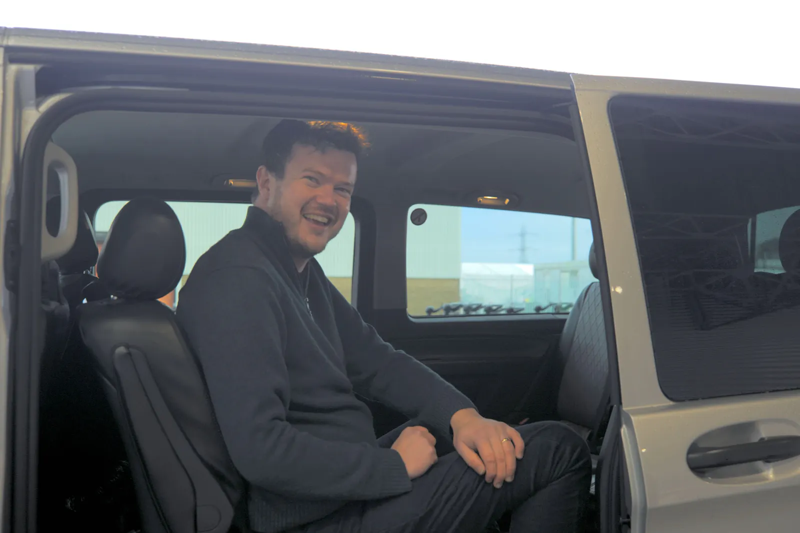Cruise customer in transfer vehicle, before boarding cruise ship