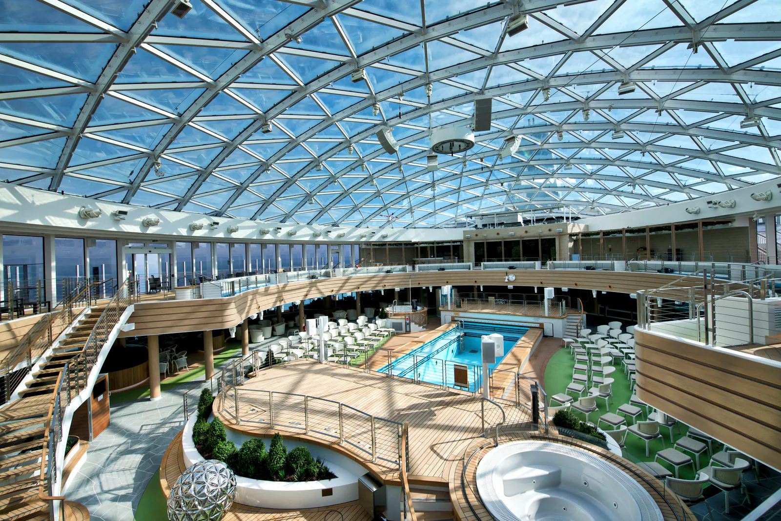 The SkyDome on P&O’s Iona, a glass-roofed pool deck with a swimming pool, hot tubs and loungers.
