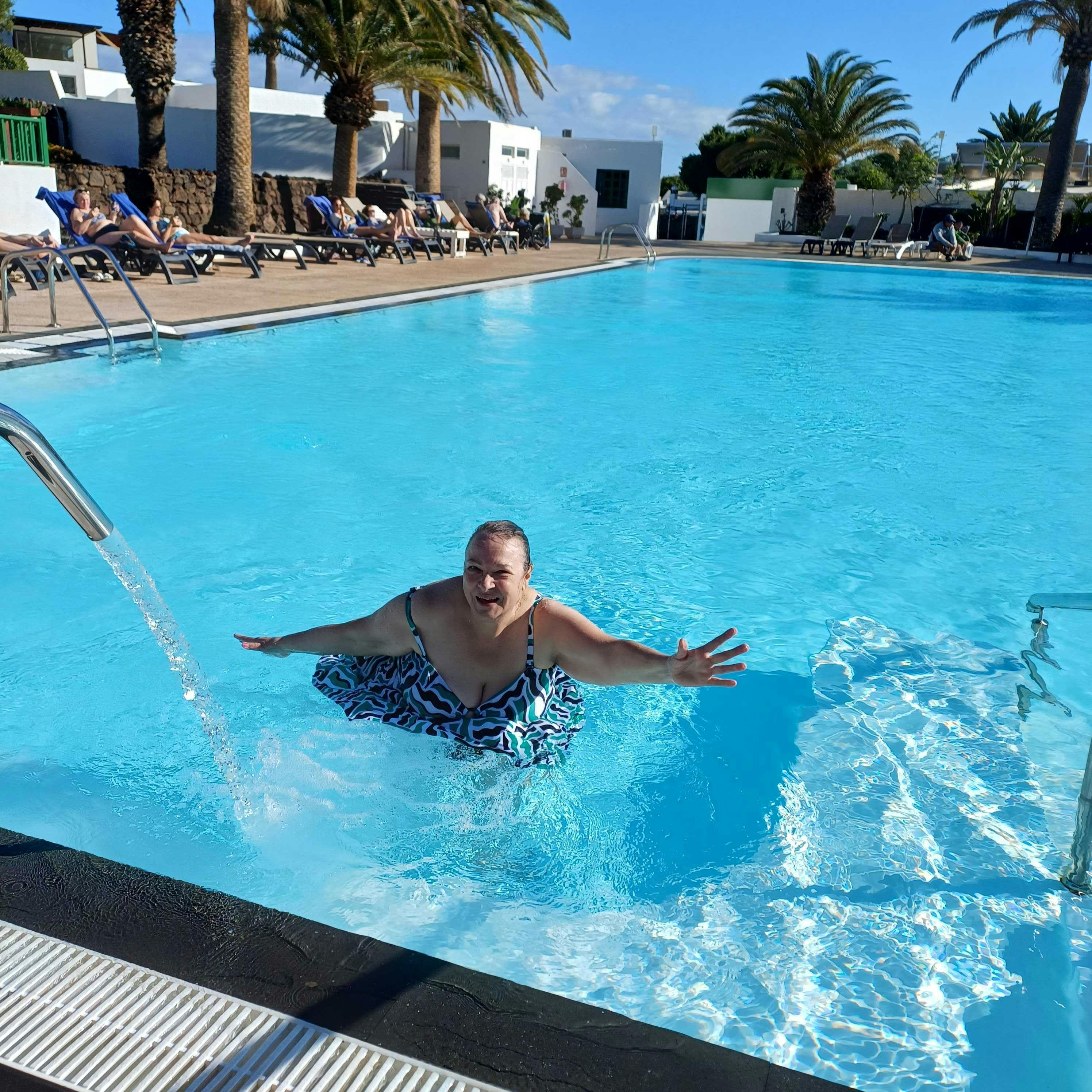 Customer enjoying the pool at accessible hotel in Lanzarote