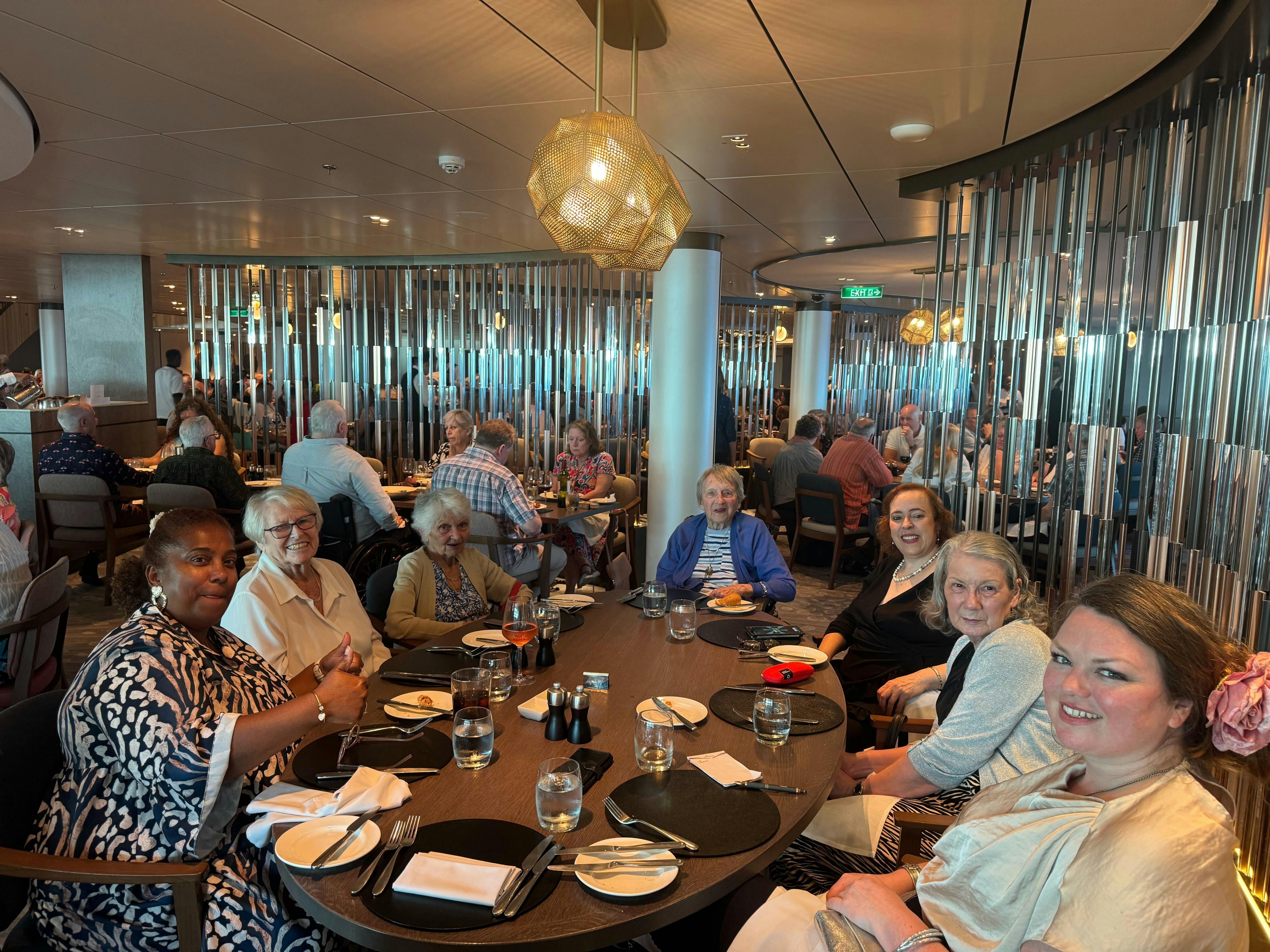Cruise Customers having dinner as a group on ship
