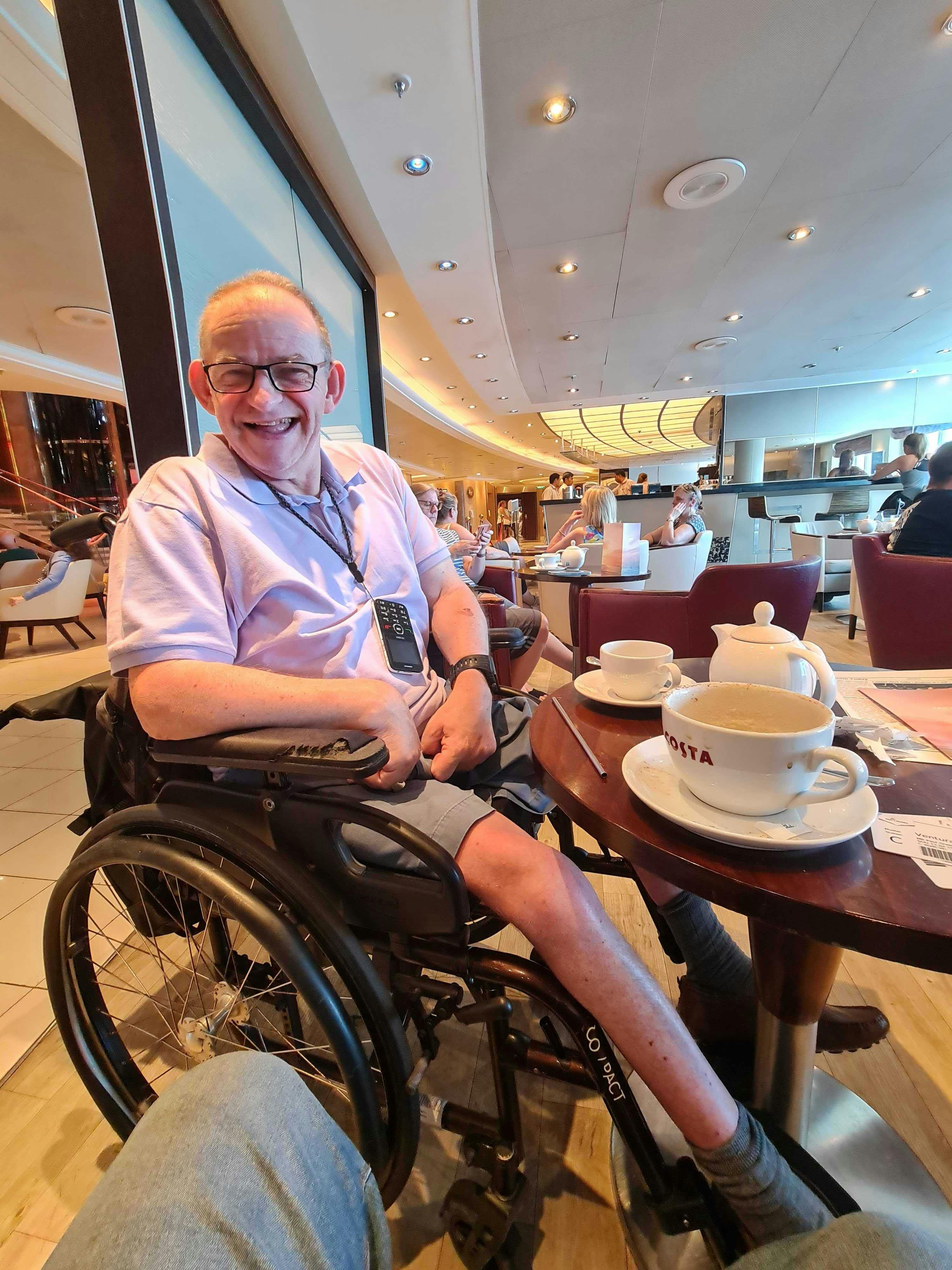 Guest enjoying a cup of tea on the Ventura Cruise ship