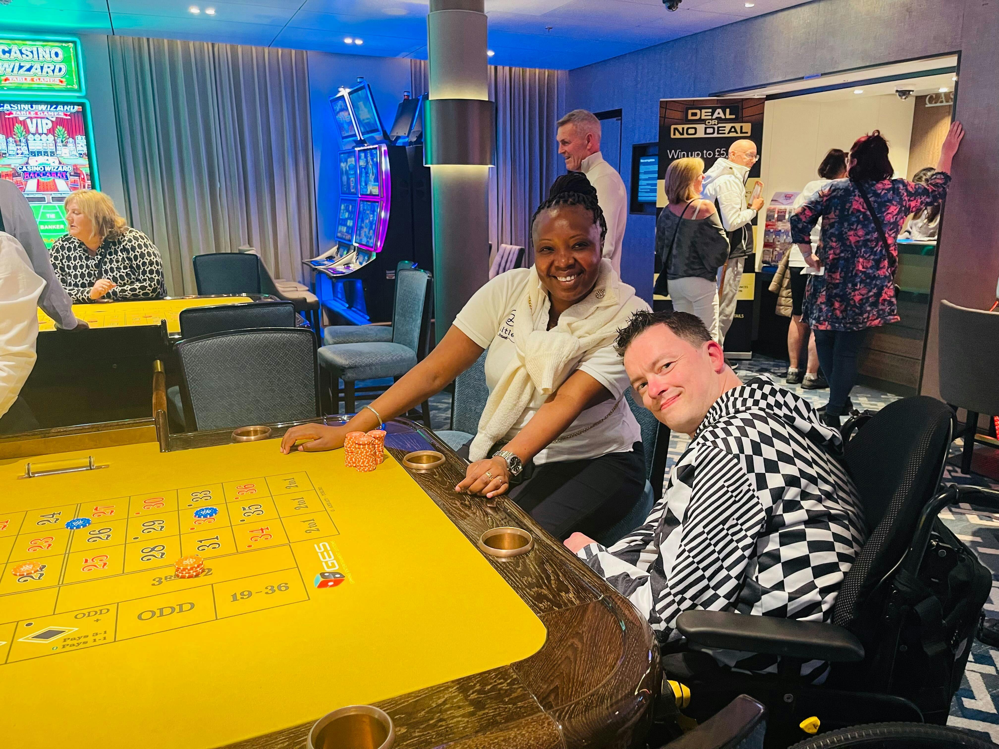 Customer and Staff on a cruise enjoying the Casino