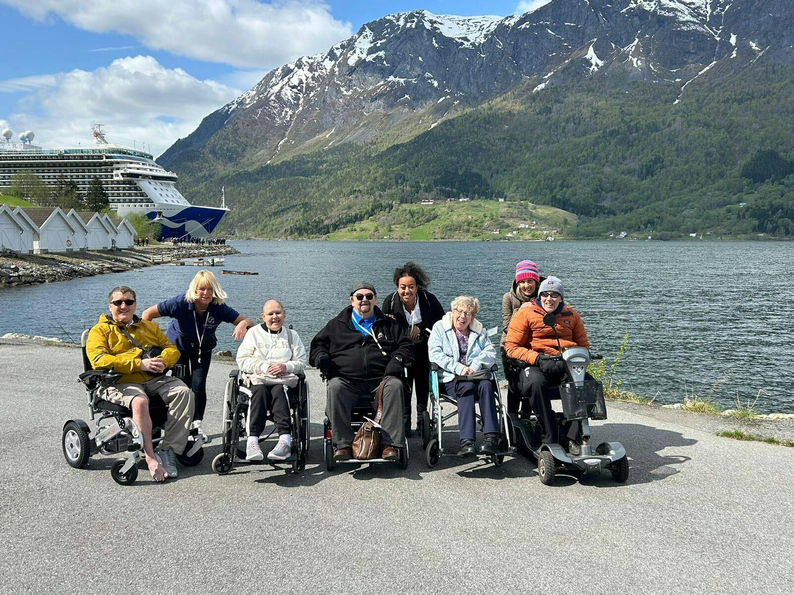 Customers on shore enjoying the sites of the Fjords