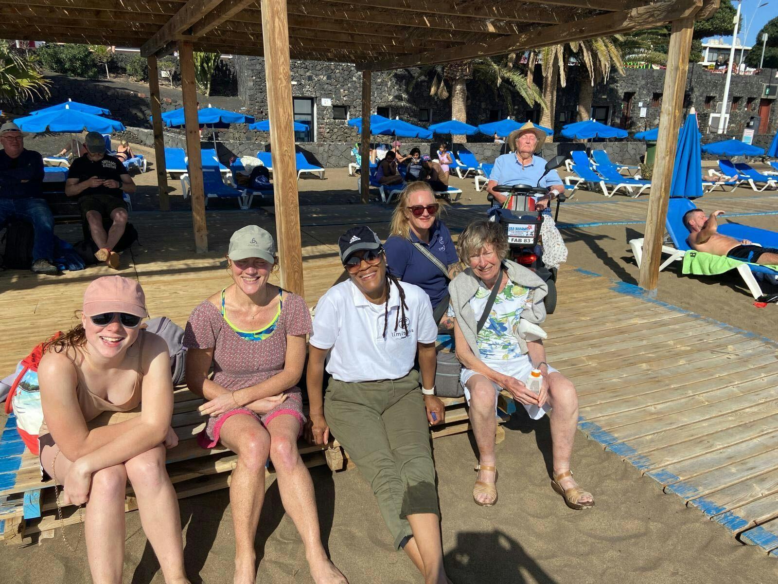 Customers and Limitless staff at the beach in Lanzarote