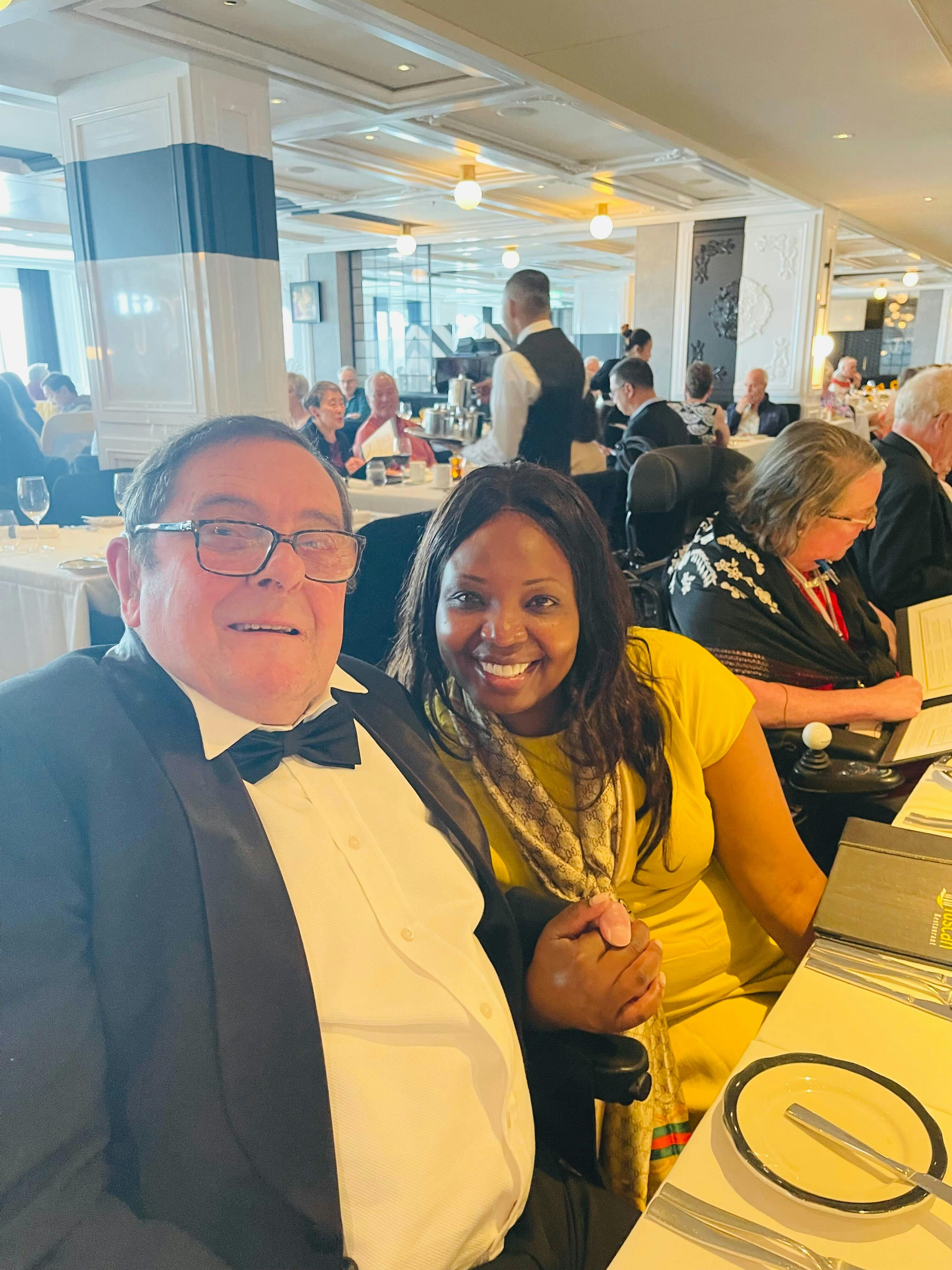 Cruise customers and staff dressed for dinner celebrity apex