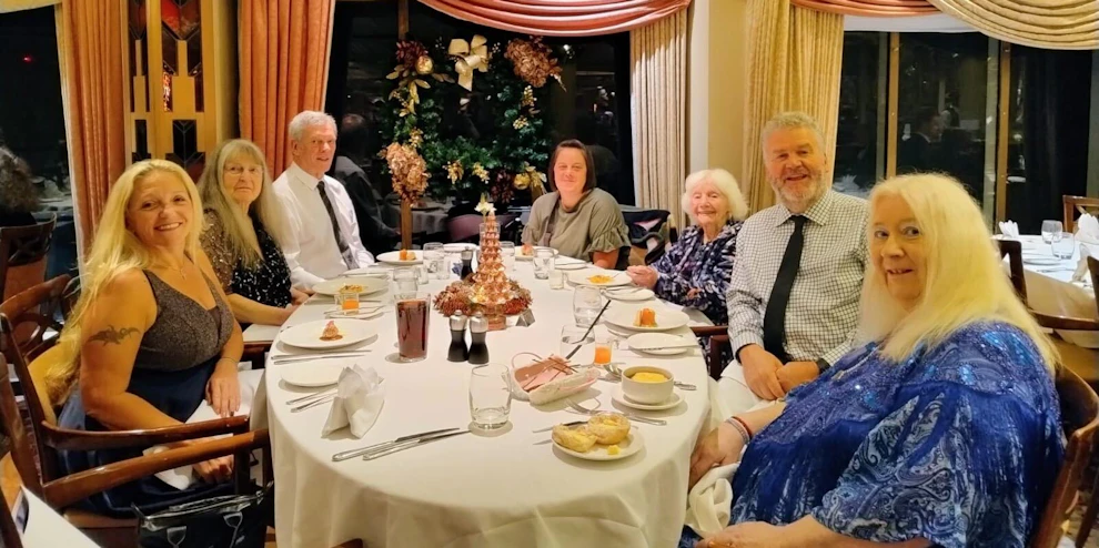 Customers and Limitless staff enjoying dinner at restaurant onboard cruise ship