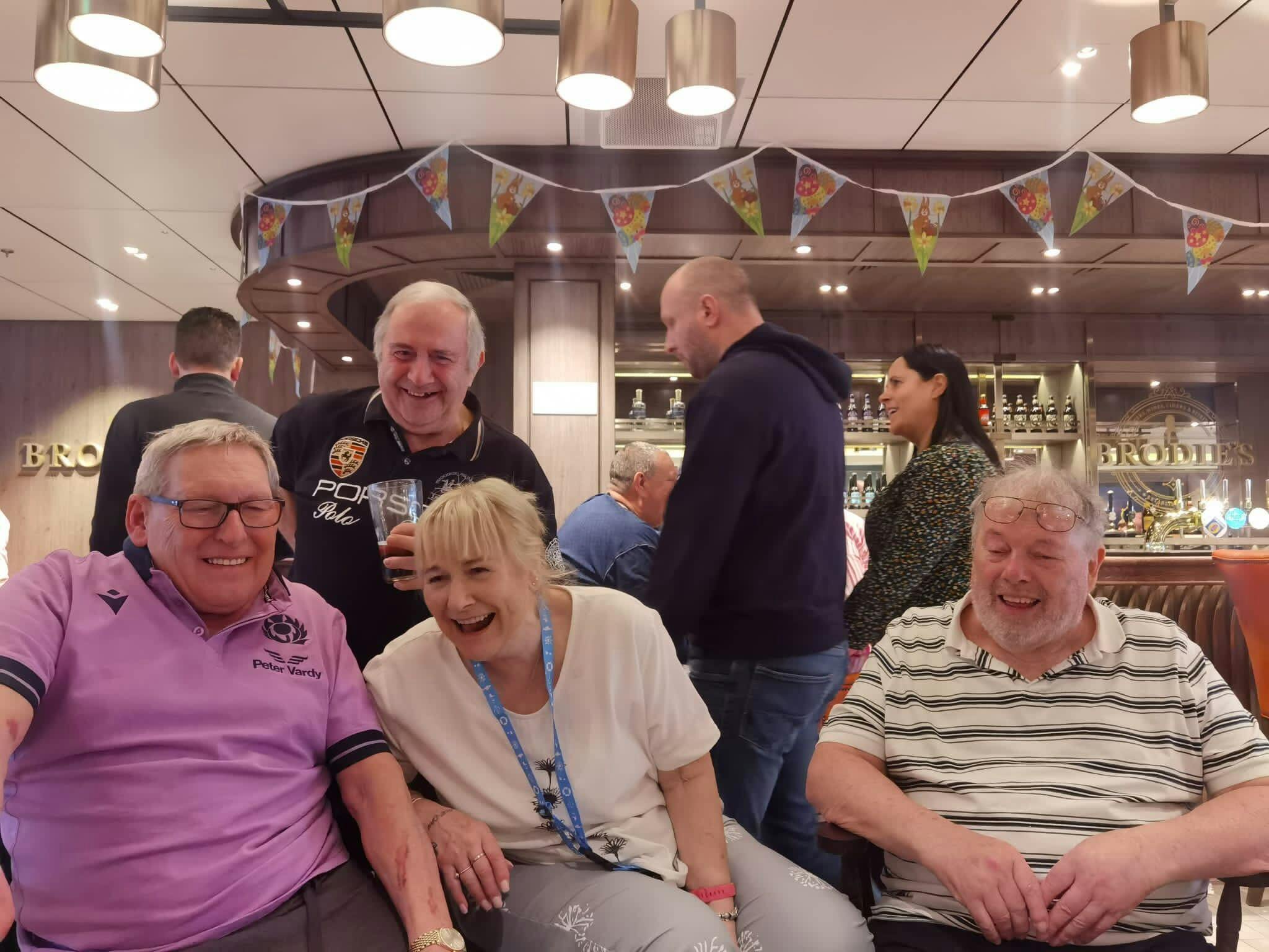 Customers having a laugh together on board a cruise ship