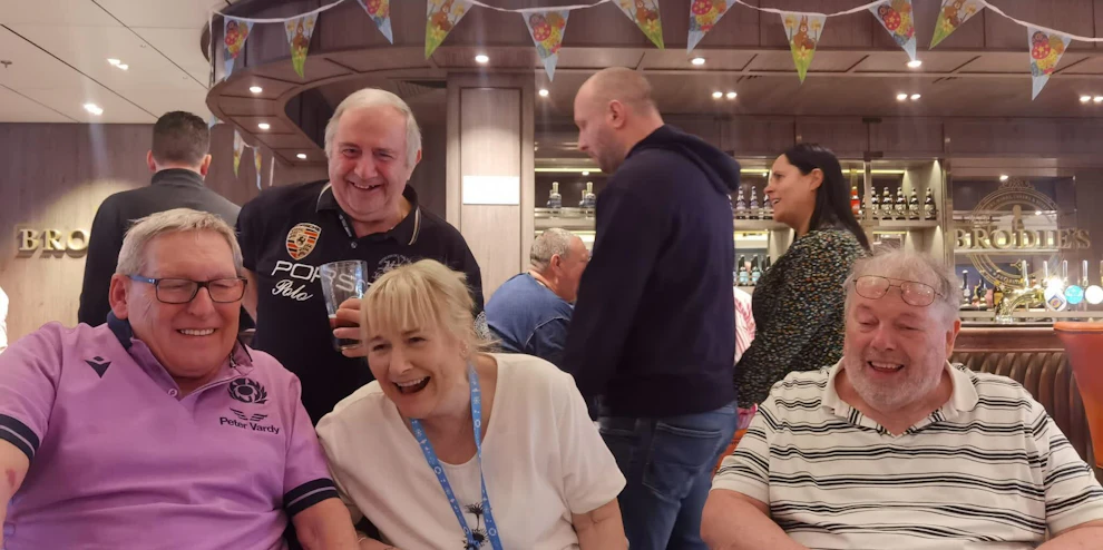 Customers having a laugh together on board a cruise ship