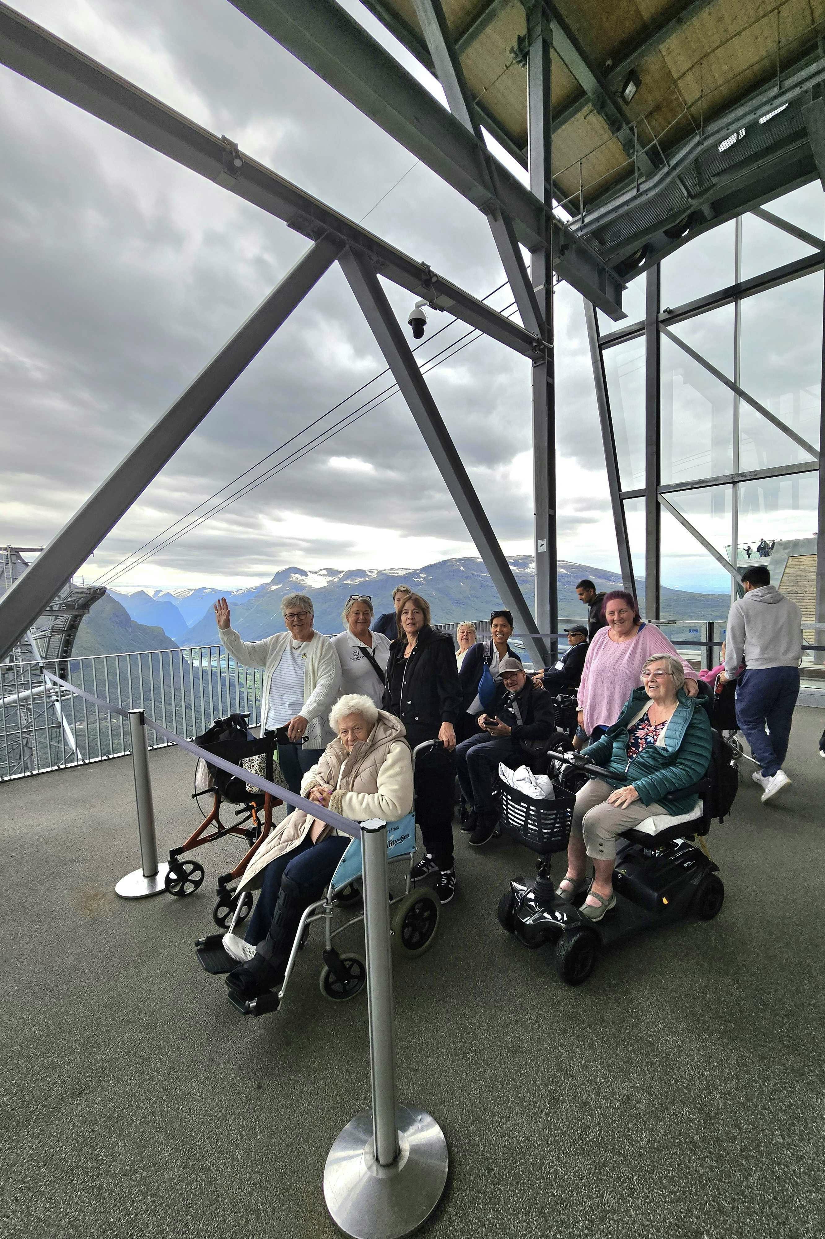 Cruise customers and staff at the top of a sky lift Norway