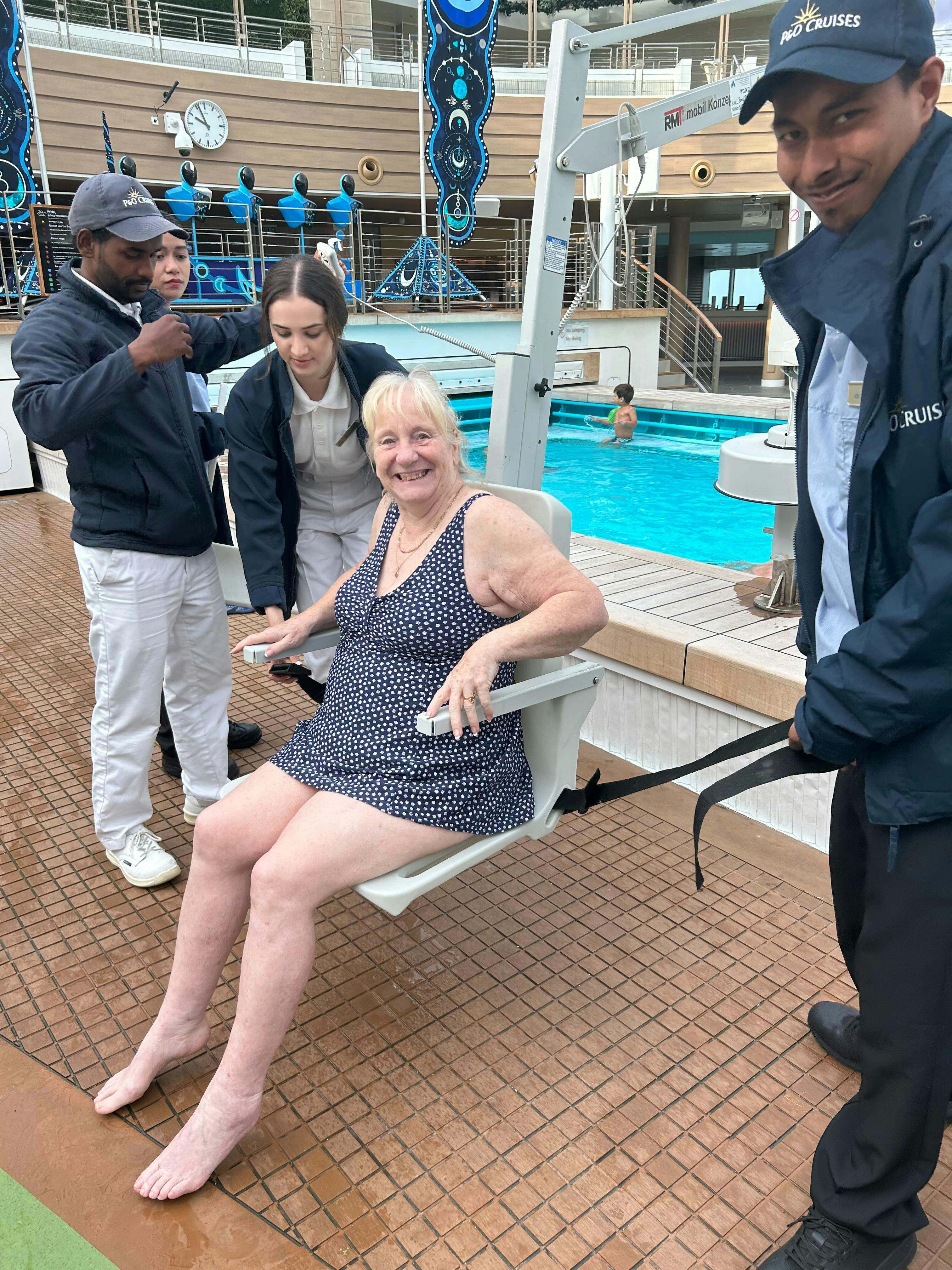 Cruise customer being hoisted into the pool on P&O cruise ship